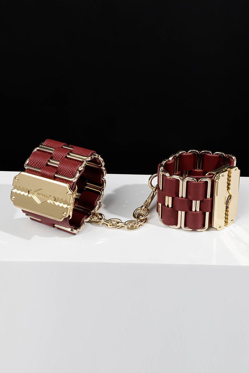 KEEN BOUND: LEATHER HANDCUFFS WITH GOLD HARDWARE