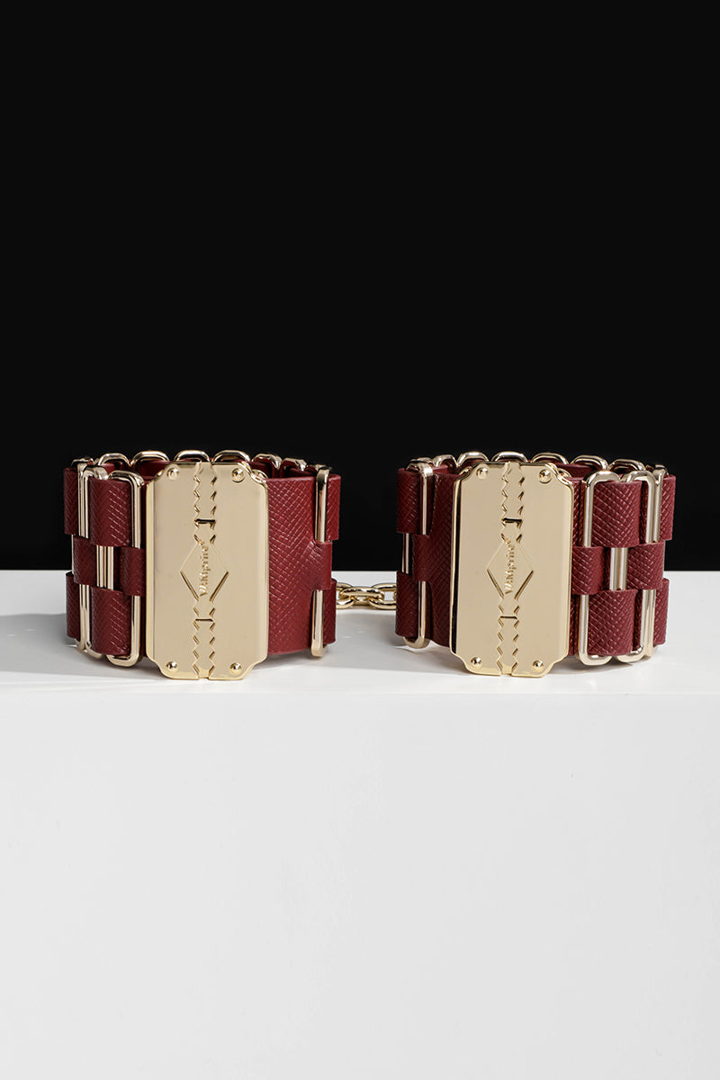 KEEN BOUND: LEATHER HANDCUFFS WITH GOLD HARDWARE