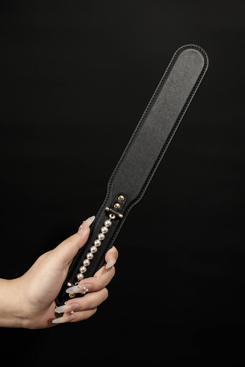 ETHEREAL RADIANCE: DOUBLE LEATHER PADDLE WITH PEARL ACCENT