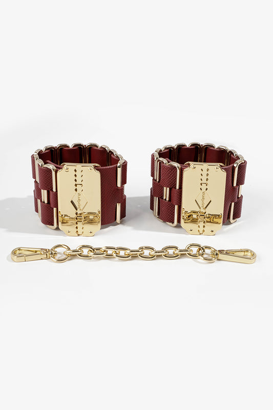 KEEN BOUND: LEATHER HANDCUFFS WITH GOLD HARDWARE