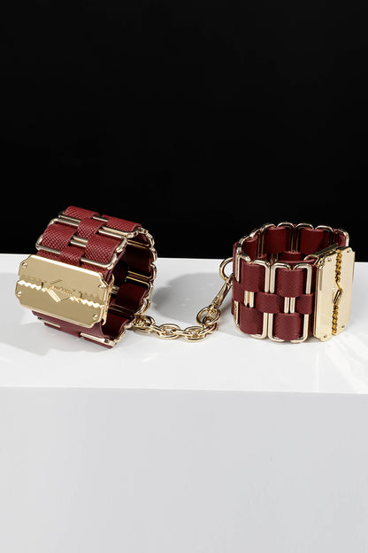 KEEN BOUND: LEATHER HANDCUFFS WITH GOLD HARDWARE