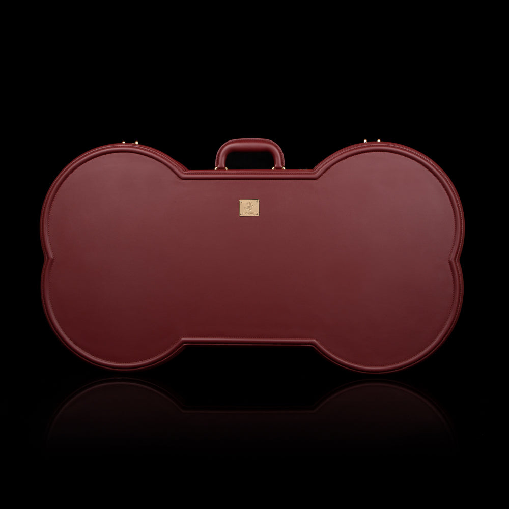 The Iron Clad Trunk — wine red leather restraints close-up