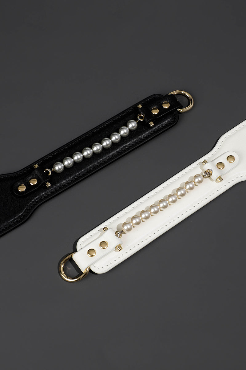 ETHEREAL RADIANCE: DOUBLE LEATHER PADDLE WITH PEARL ACCENT