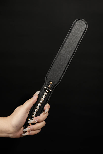 ETHEREAL RADIANCE: DOUBLE LEATHER PADDLE WITH PEARL ACCENT
